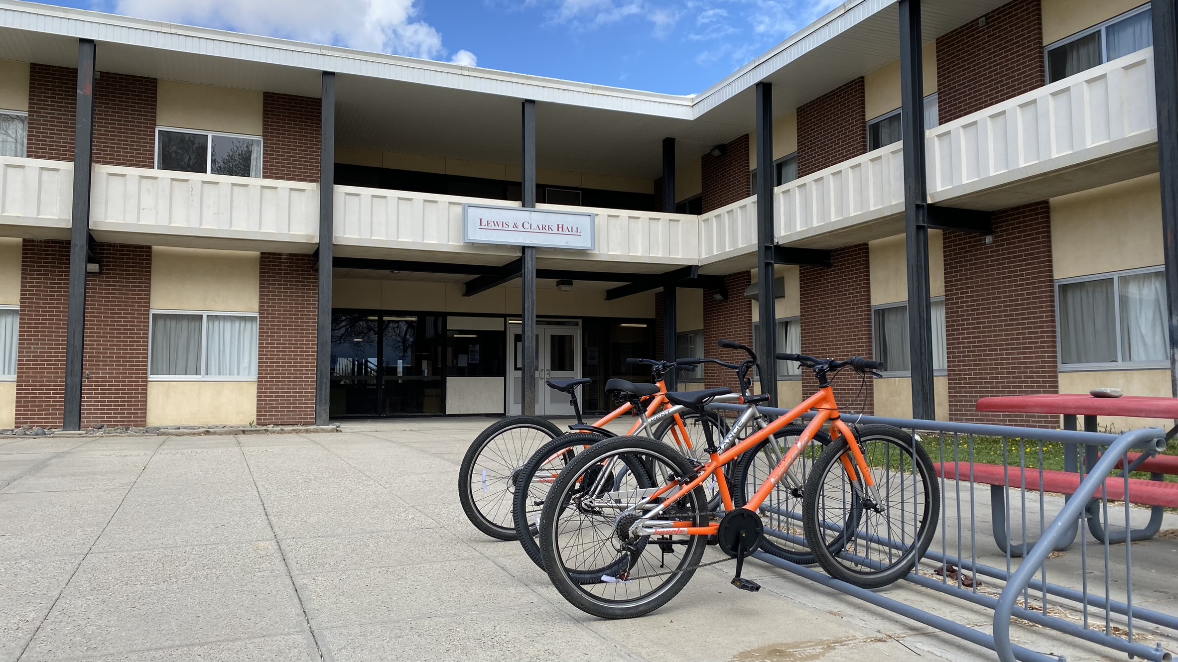 Entrance to Lewis and Clark Hall with bikes in bike rack