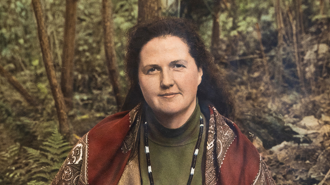 Christine Garceau with long dark hair in a woodland setting